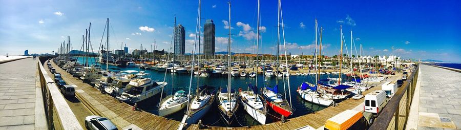 Panoramic view of boats moored at harbor