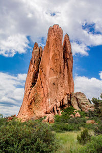 Low angle view of rock formation against sky