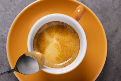 High angle view of coffee cup on table