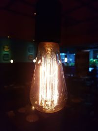 Close-up of illuminated light bulb