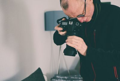 Midsection of man photographing