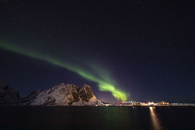 Scenic view of sea against star field at night