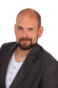 Portrait of young man against white background