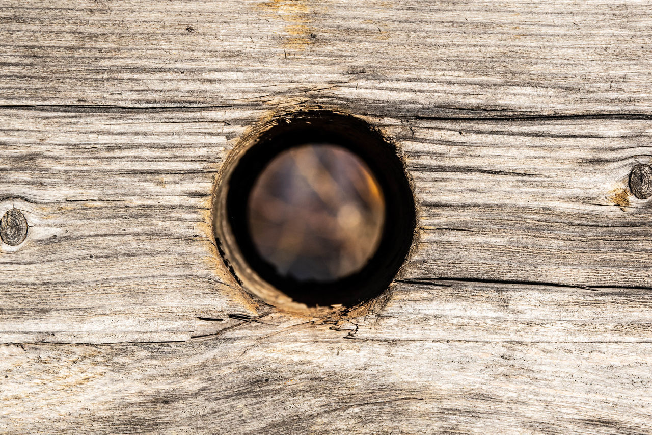 FULL FRAME SHOT OF WOODEN DOOR WITH HOLE