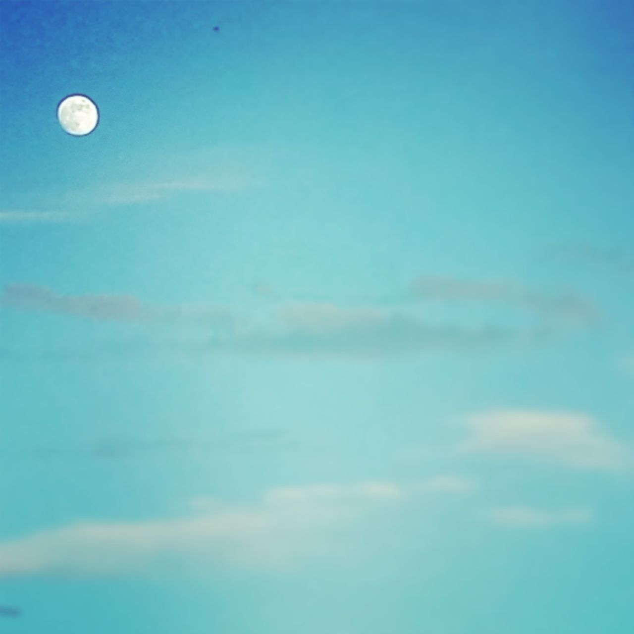 low angle view, moon, blue, sky, beauty in nature, sky only, scenics, nature, astronomy, full moon, tranquility, cloud - sky, space exploration, planetary moon, tranquil scene, circle, outdoors, idyllic, copy space, cloud