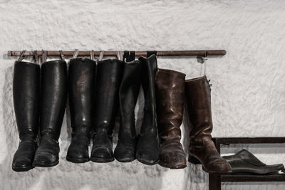 Leather shoes hanging on wall 