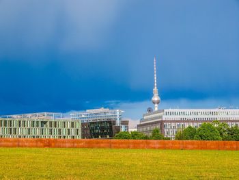 View of buildings against cloudy sky