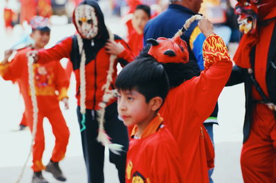 Group of people in traditional clothing during festival