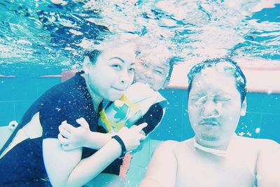 Close-up of two people in water