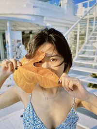 Portrait of young woman in swimming pool
