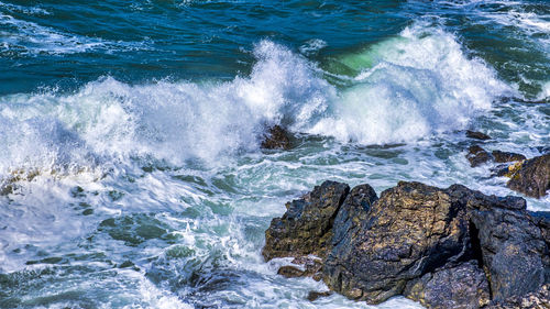 View of waves splashing on rocks