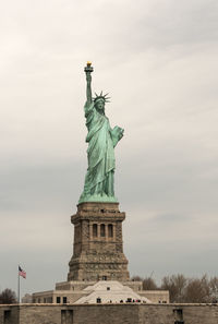 Low angle view of statue against cloudy sky