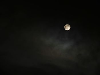 Low angle view of moon against sky at night