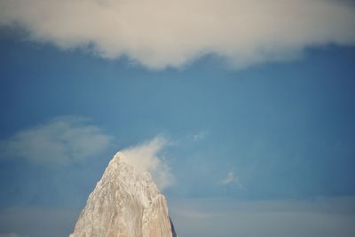 Low angle view of rock formation against sky