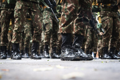 Low view of the legs of brazilian army soldiers marching through the streets of salvador