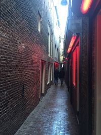 People walking on sidewalk in city