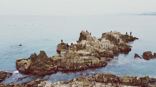 High angle view of rock formations at sea