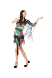 Full length of woman standing against white background