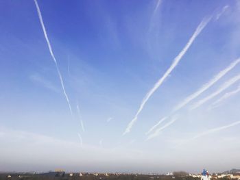 Vapor trails in blue sky