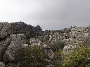 Rock formations on landscape against sky