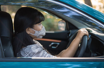 Woman sitting in car