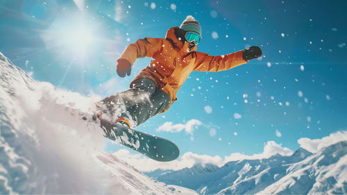 Rear view of woman standing on snow covered mountain