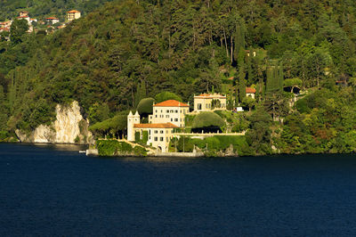 Scenic view of sea with buildings in background