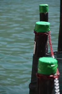 Close-up of rope tied up on water