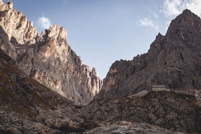 Low angle view of rock formations against sky