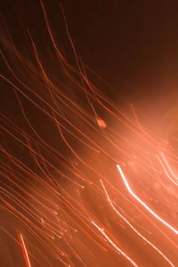 Low angle view of firework display against sky at night