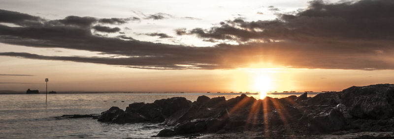 Scenic view of sea at sunset