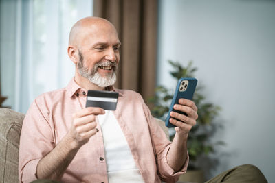 Young man using mobile phone