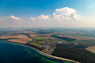 Aerial view of agricultural landscape against sky