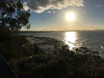 Scenic view of sea against sky at sunset