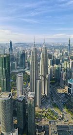 High angle view of modern buildings in city against sky
