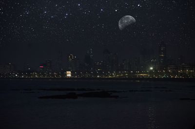 Scenic view of moon against sky at night