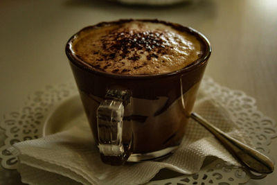 Close-up of cappuccino on table