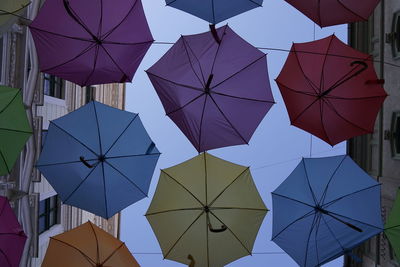 Low angle view of umbrellas hanging