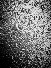 Full frame shot of wet glass window