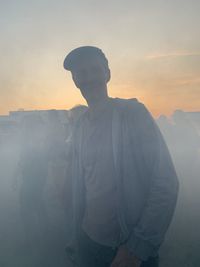 Silhouette man standing against sky during sunset