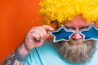 Close-up portrait of man wearing mask