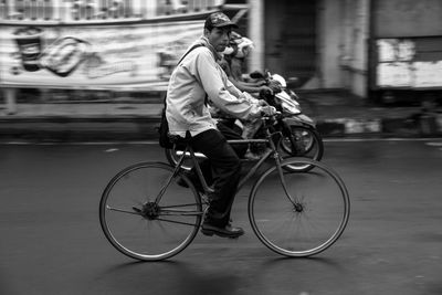 The moment cycling side by side with motorbike. man riding bicycle