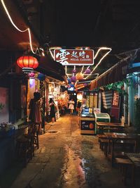 People at market in city at night