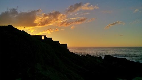 Scenic view of sea at sunset