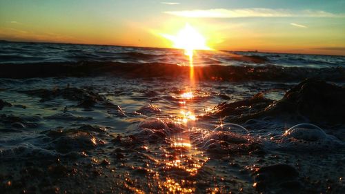 Scenic view of sea at sunset