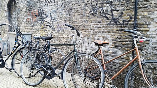 Bicycle parked against wall
