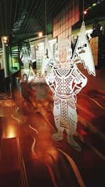 Illuminated lights seen through glass window at night