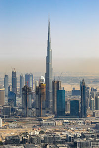 Modern buildings in city against sky