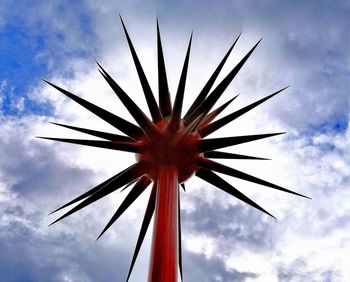 Low angle view of silhouette palm tree against sky