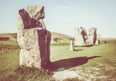 Built structure on landscape against sky